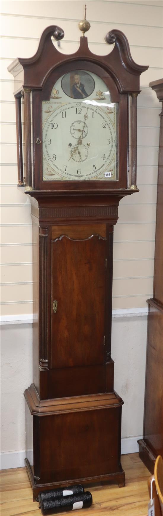 An early 19th century mahogany 8 day striking longcase clock, the arched enamelled dial painted with a portrait of Admiral Lord Nelson